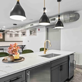 All the comforts of luxury living kitchen with island and seating