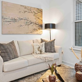 Relax and unwind in stylish living spaces living room with couch and coffee table