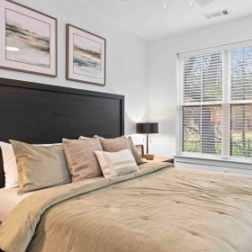 Relax and recharge in beautiful and spacious bedrooms bedroom with bed and large window